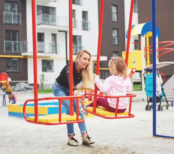 mother-with-child-on-the-playground-e1632831315661.jpg
